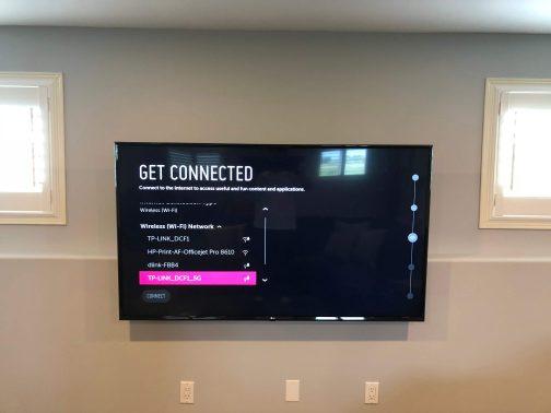 TV wall mounted Installed between 2 windows with wires hidden