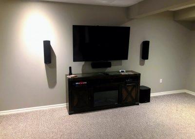 65" TV Wall mounted above TV stand with Left Right and Centre Speakers