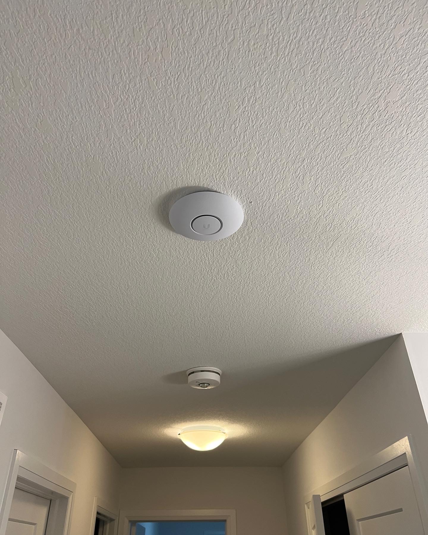 Ubiquiti AC LR Access Point Ceiling Mounted in Line with lights