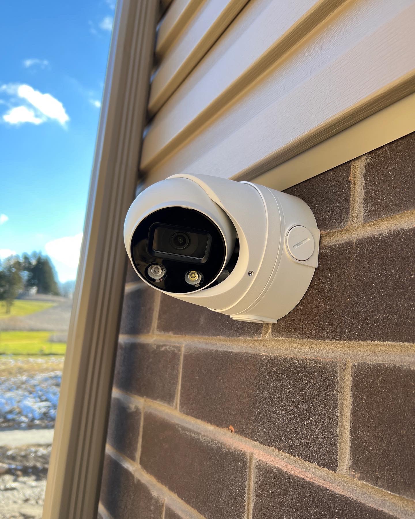 4K IP Turret Security Camera with Active Deterrent LED installed on Brick