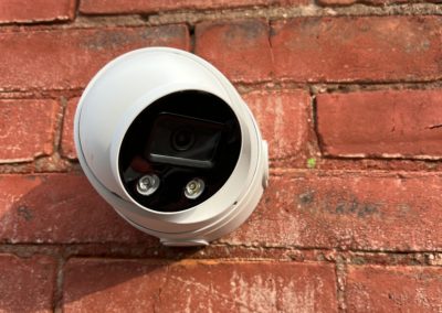 4K IP Turret Security Camera with Active Deterrent LED installed on Brick