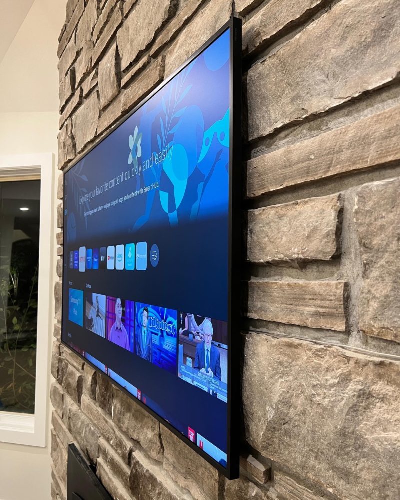 65" Frame TV Installed on stone wall