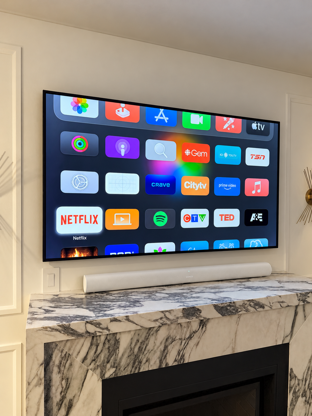 Professional TV installation on tile with Sonos soundbar and concealed wiring by Hamilton Tech Source