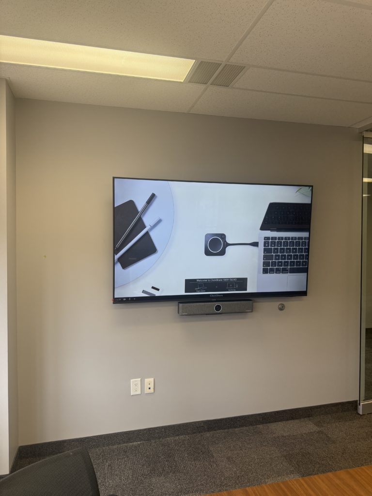 Wall-mounted TV installed in an office by Hamilton Tech Source