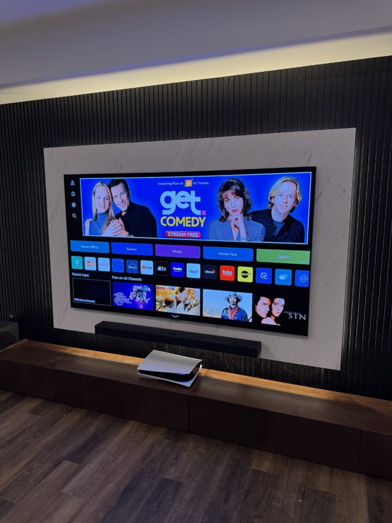 TV and soundbar installed within a recessed feature wall by Hamilton Tech Source